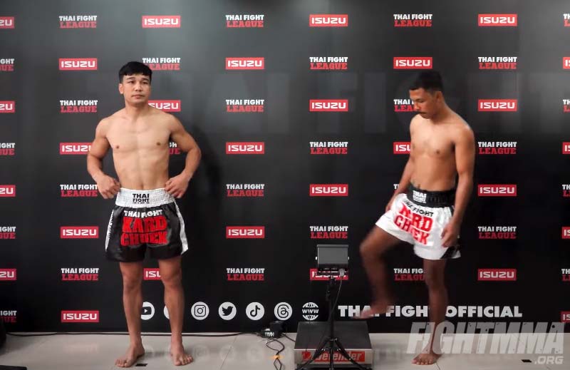 Muay thai fighter stepping on a weight scale